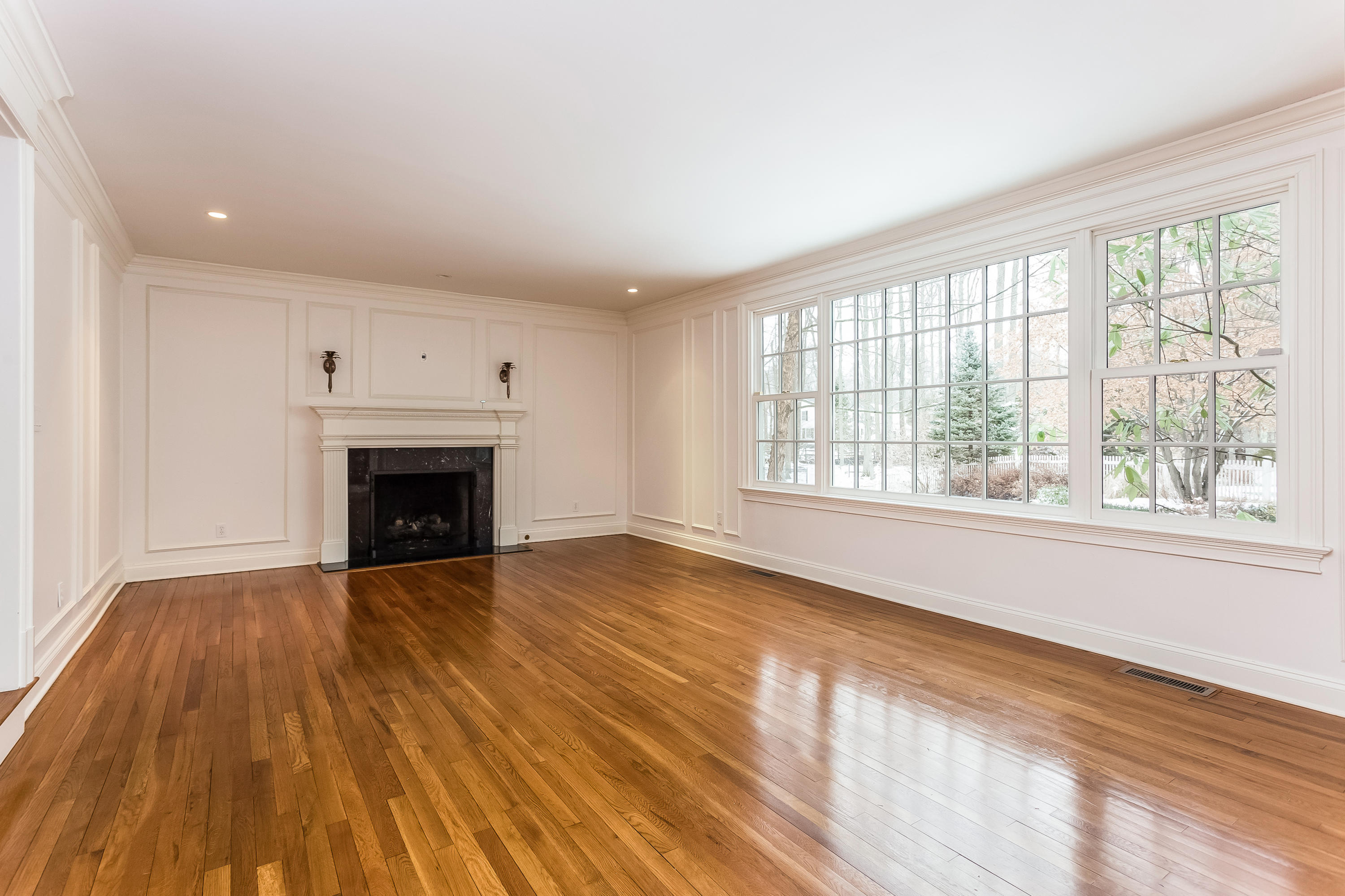 183 Turtle Back Road New Canaan, CT 06840 - Photo 14 of 53 a view of empty room with wooden floor and fireplace