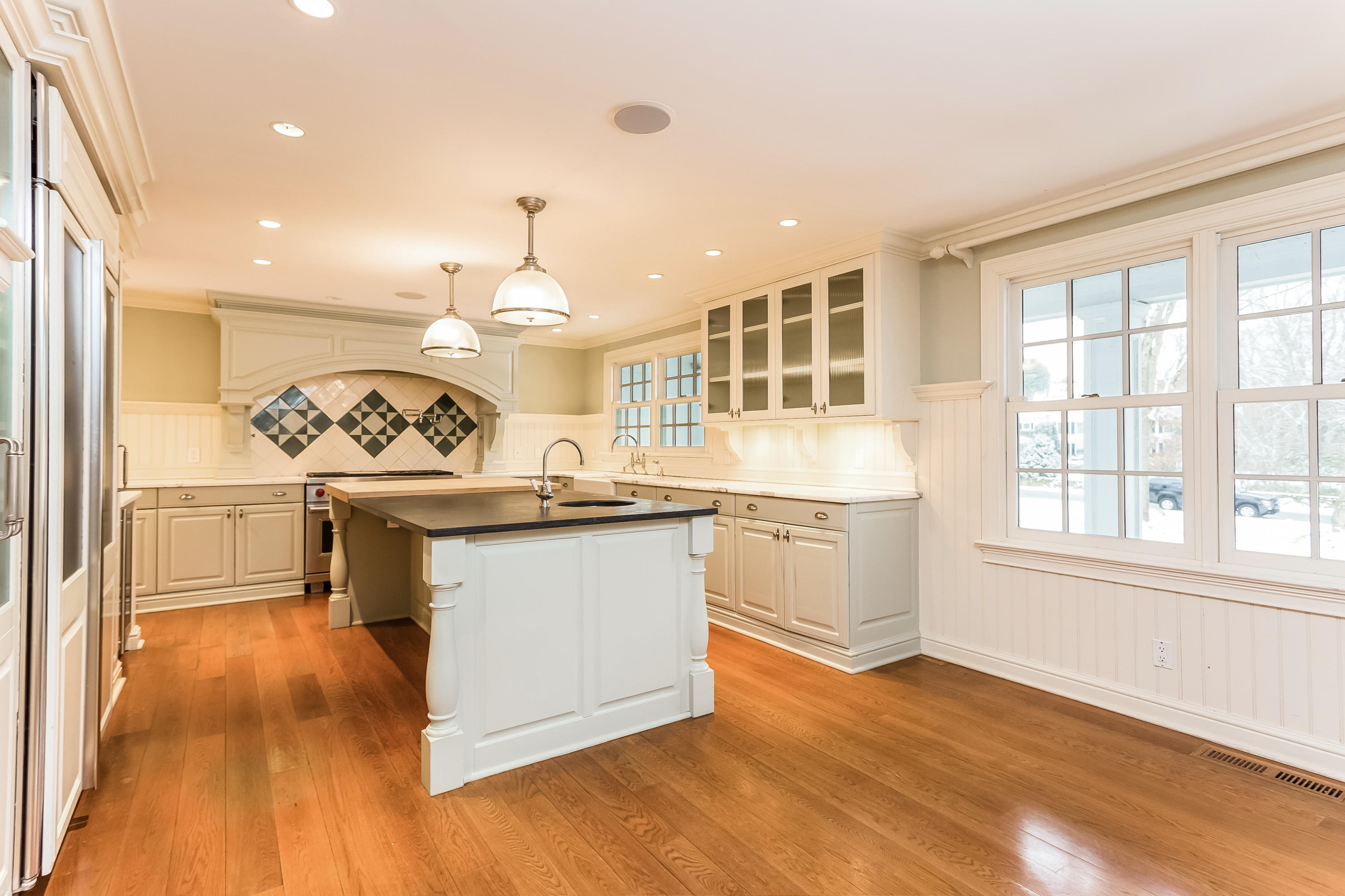 183 Turtle Back Road New Canaan, CT 06840 - Photo 15 of 53 a kitchen with granite countertop a stove and a sink