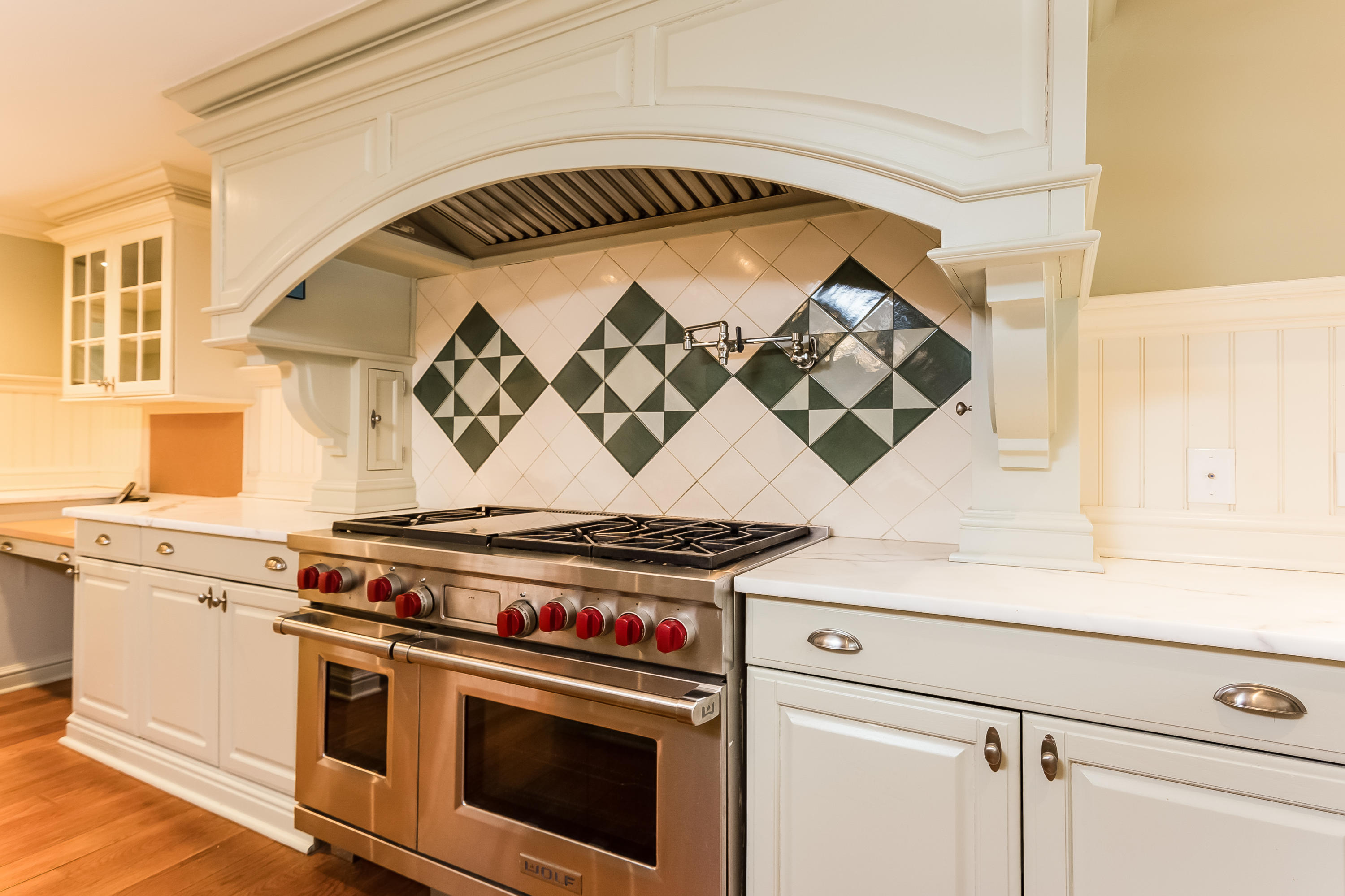 183 Turtle Back Road New Canaan, CT 06840 - Photo 16 of 53 a stove top oven sitting inside of a kitchen