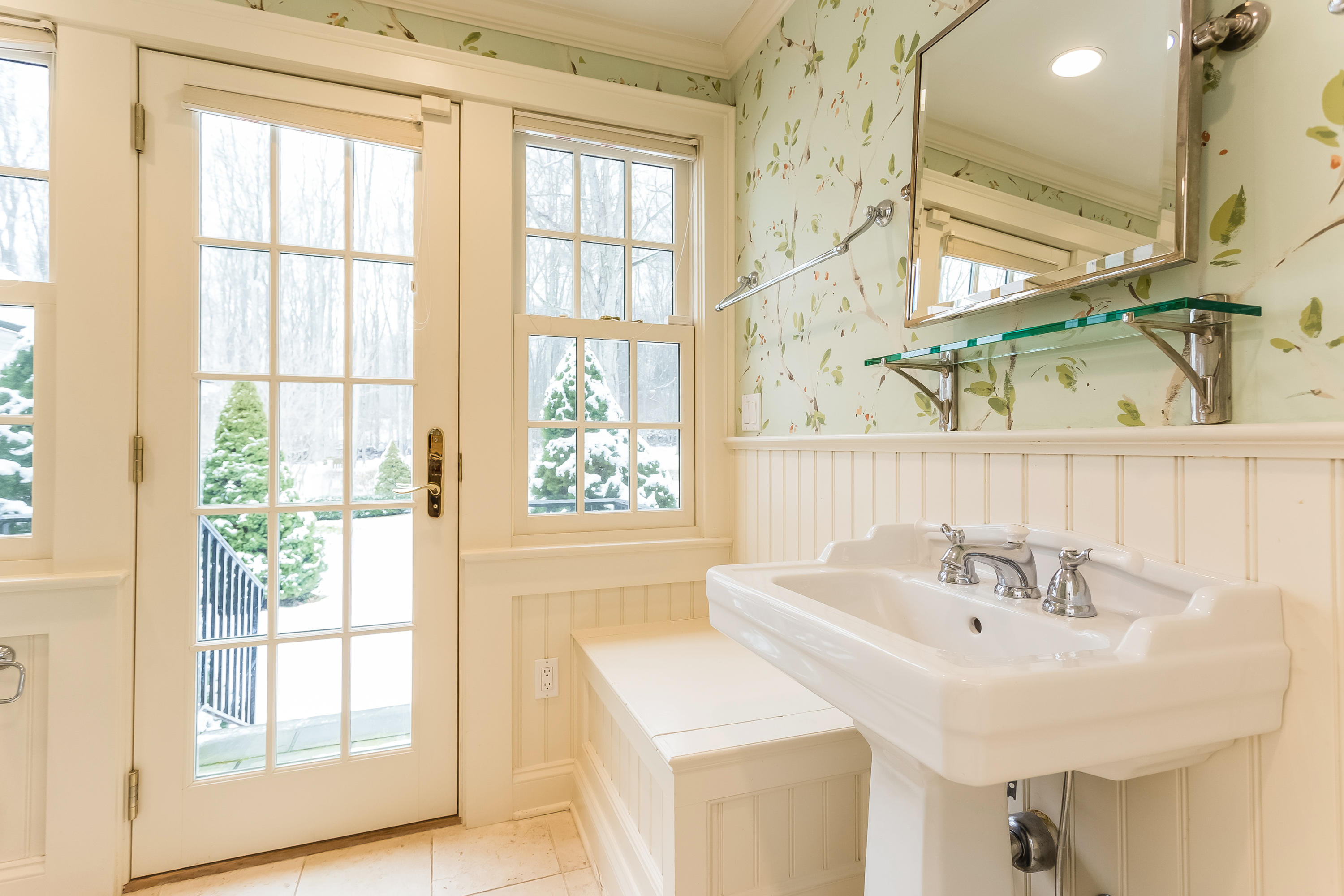 183 Turtle Back Road New Canaan, CT 06840 - Photo 20 of 53 a bathroom with a sink and a window