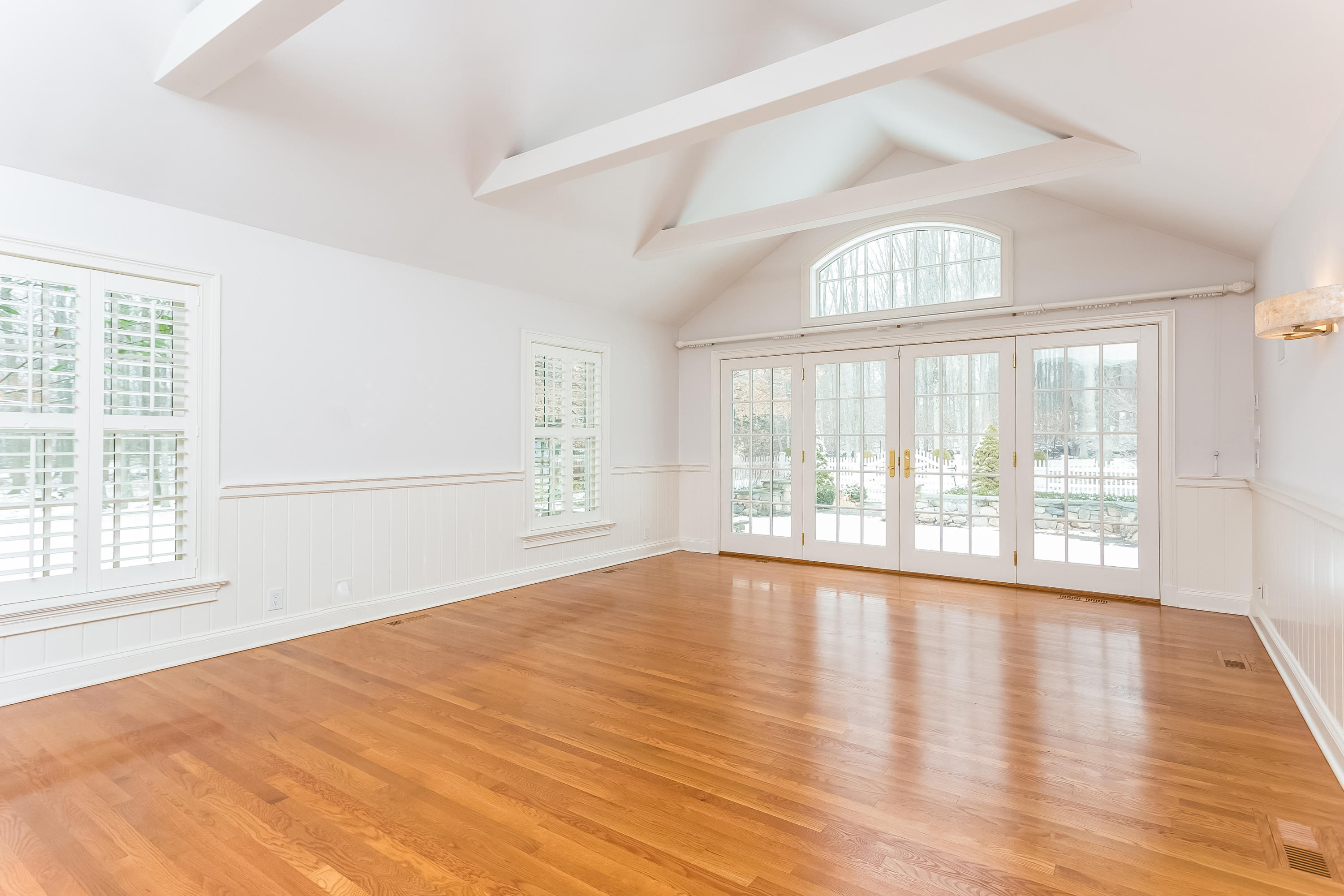 183 Turtle Back Road New Canaan, CT 06840 - Photo 21 of 53 an empty room with wooden floor and windows