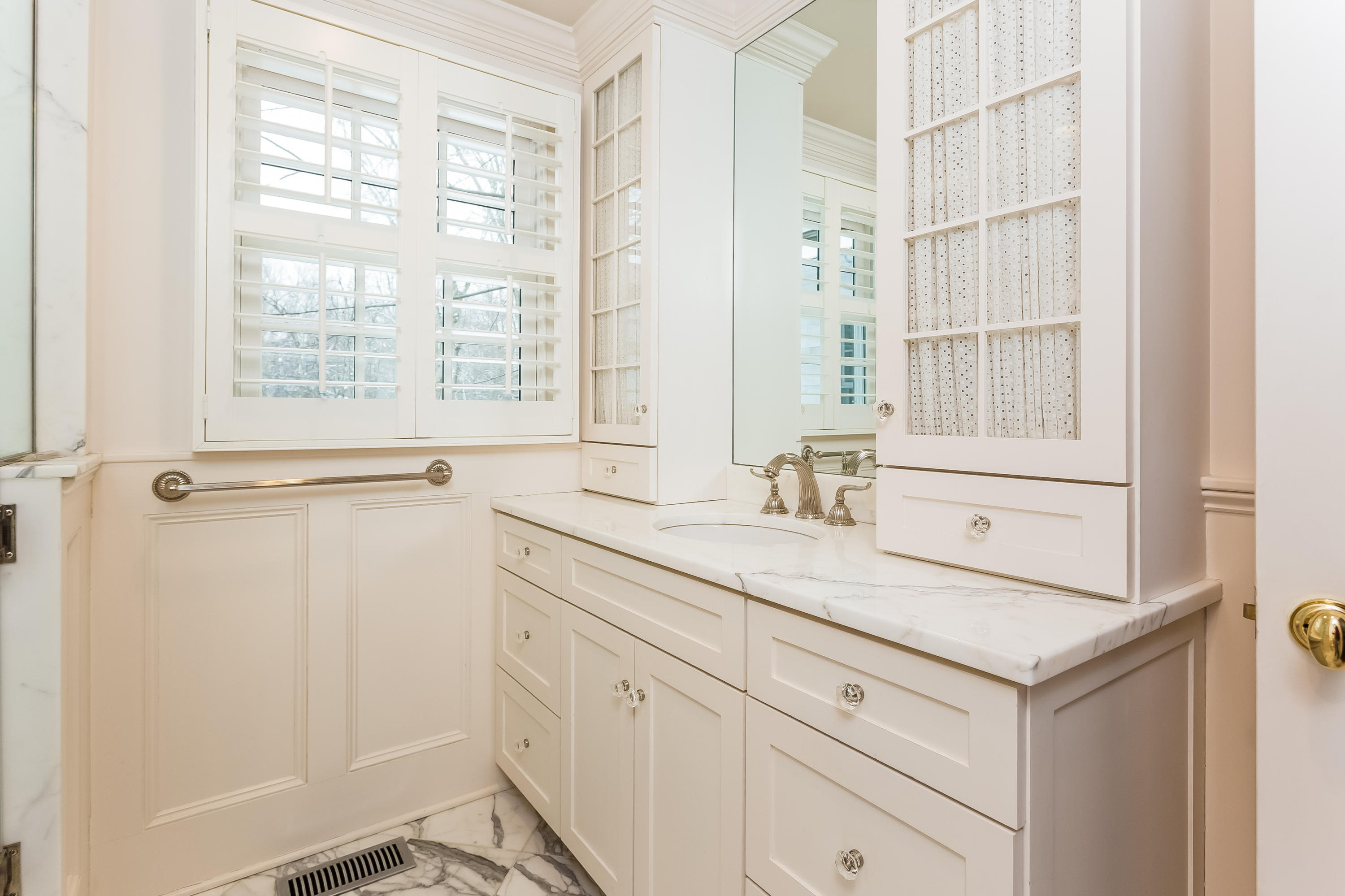 183 Turtle Back Road New Canaan, CT 06840 - Photo 24 of 53 a bathroom with a sink and a mirror