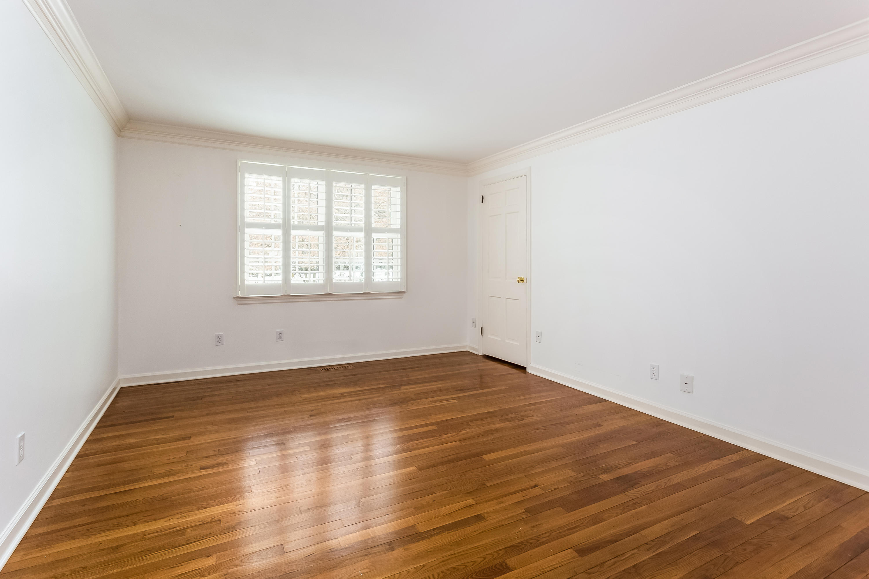 183 Turtle Back Road New Canaan, CT 06840 - Photo 26 of 53 an empty room with wooden floor and windows