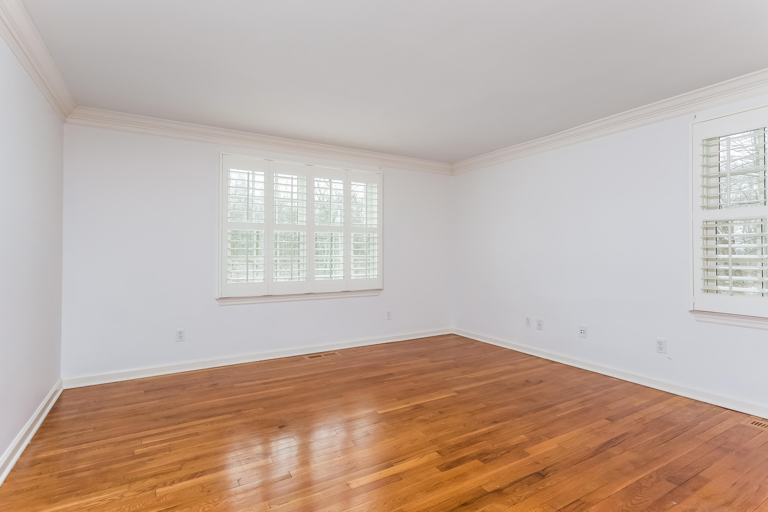 183 Turtle Back Road New Canaan, CT 06840 - Photo 28 of 53 a view of empty room with wooden floor and fan