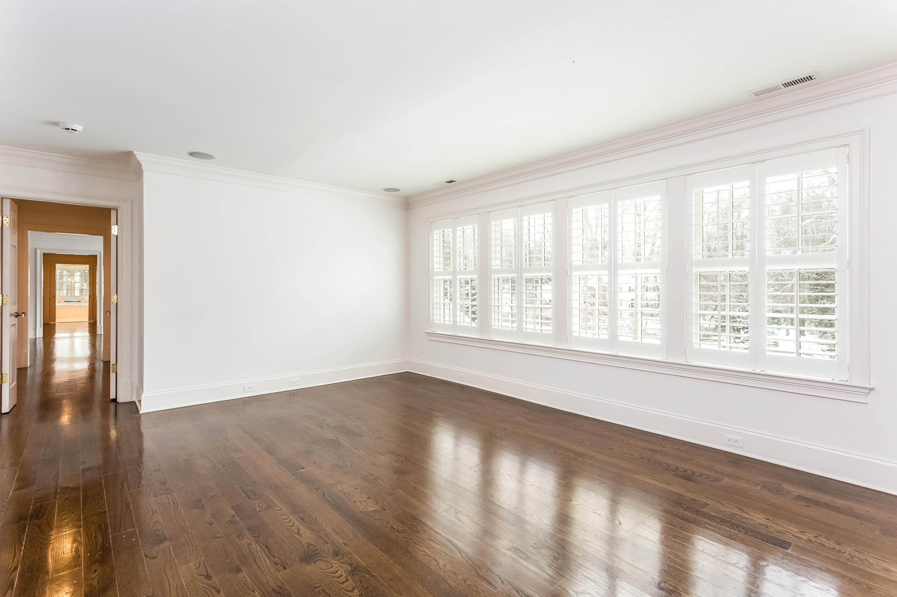 183 Turtle Back Road New Canaan, CT 06840 - Photo 31 of 53 a view of an empty room with wooden floor and a window