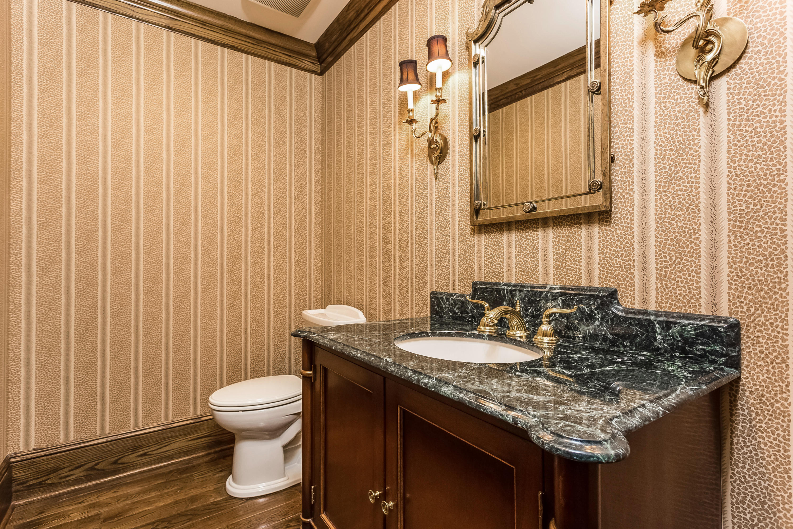 183 Turtle Back Road New Canaan, CT 06840 - Photo 35 of 53 a bathroom with a granite countertop sink and a mirror