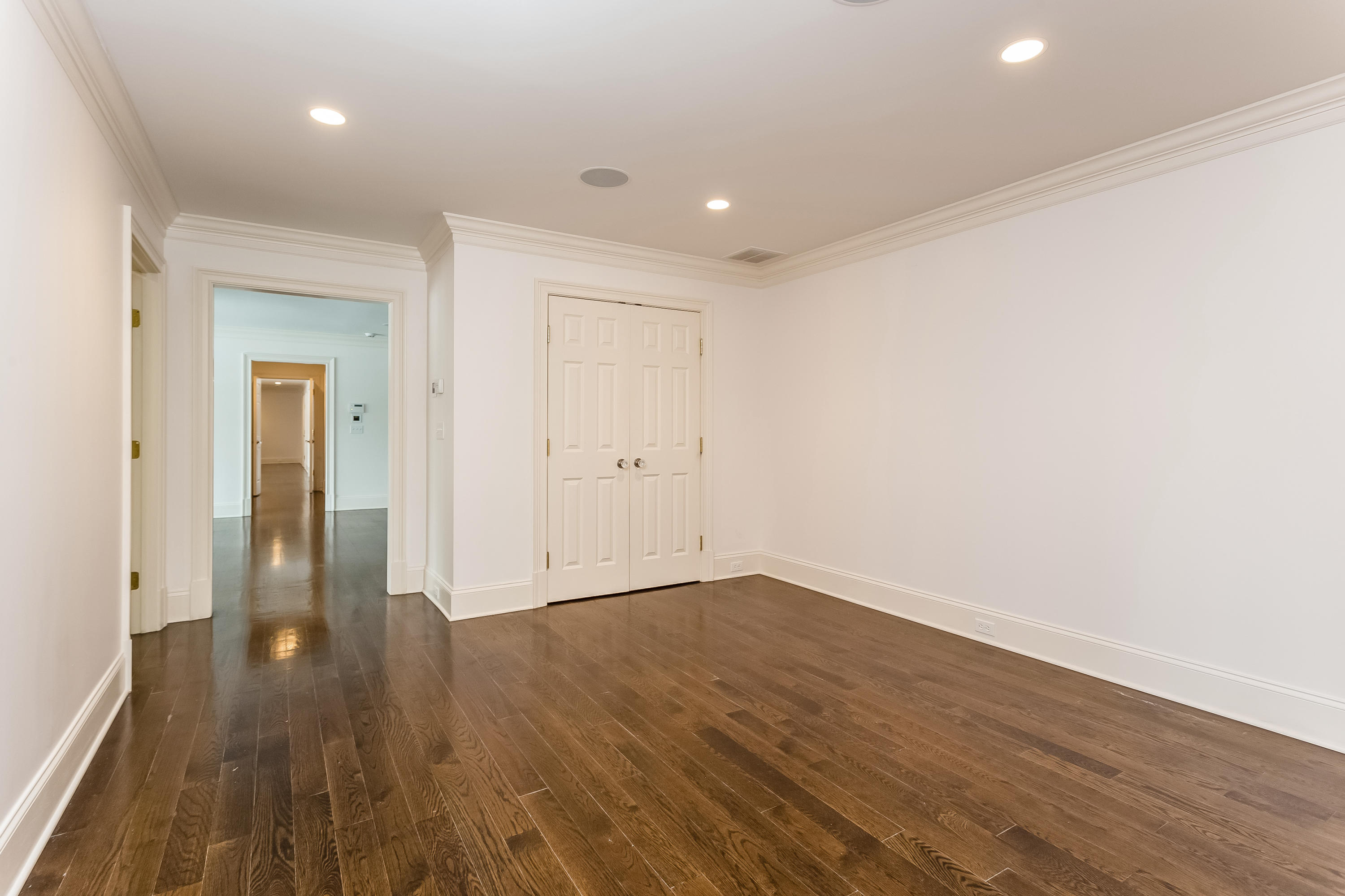 183 Turtle Back Road New Canaan, CT 06840 - Photo 36 of 53 a view of a hallway with wooden floor