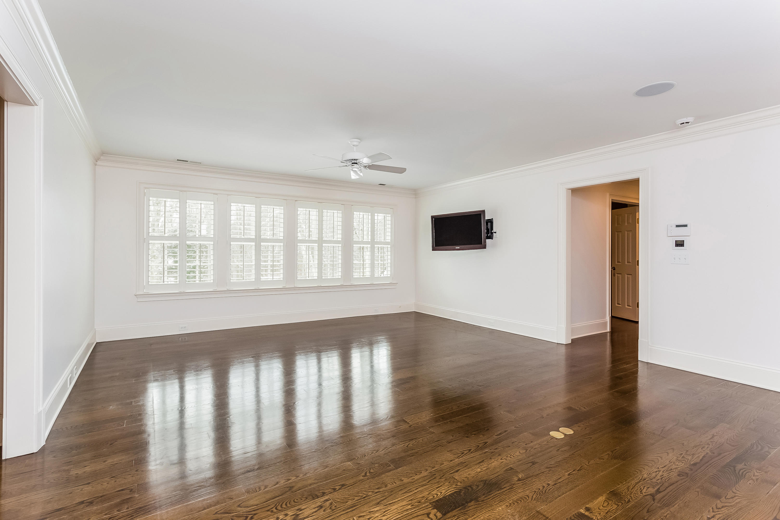 183 Turtle Back Road New Canaan, CT 06840 - Photo 37 of 53 wooden floor in an empty room with a window