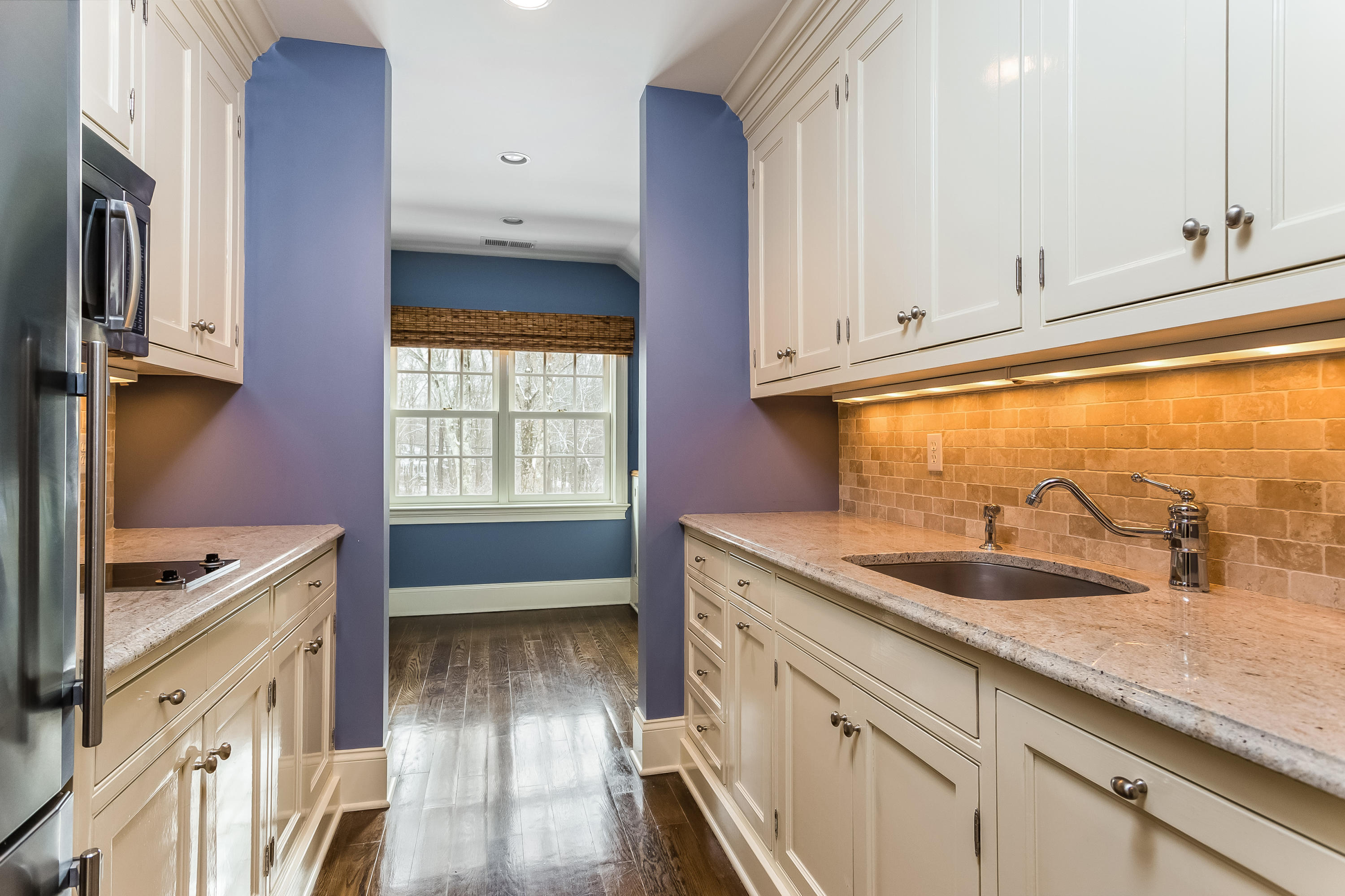 183 Turtle Back Road New Canaan, CT 06840 - Photo 43 of 53 a kitchen with granite countertop a sink and a stove