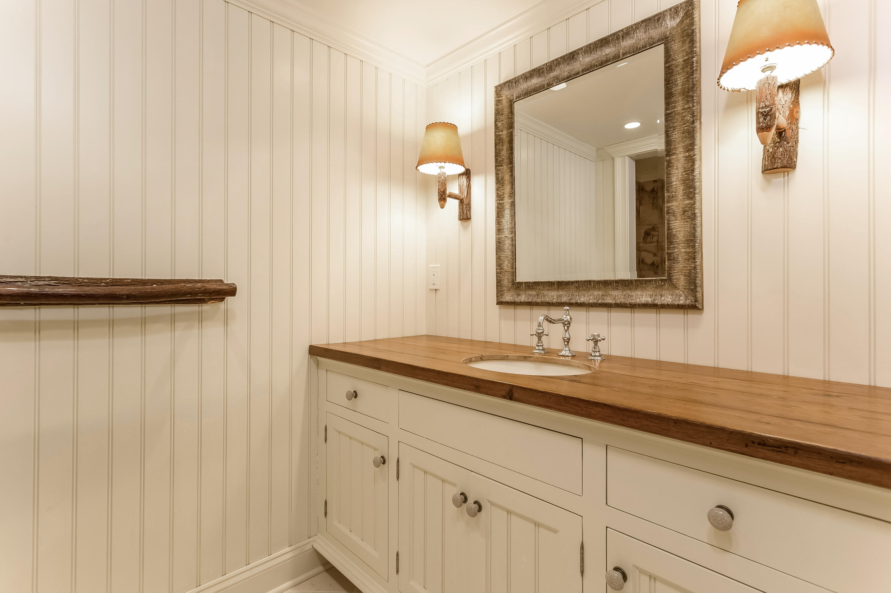 183 Turtle Back Road New Canaan, CT 06840 - Photo 47 of 53 a bathroom with a sink and a mirror