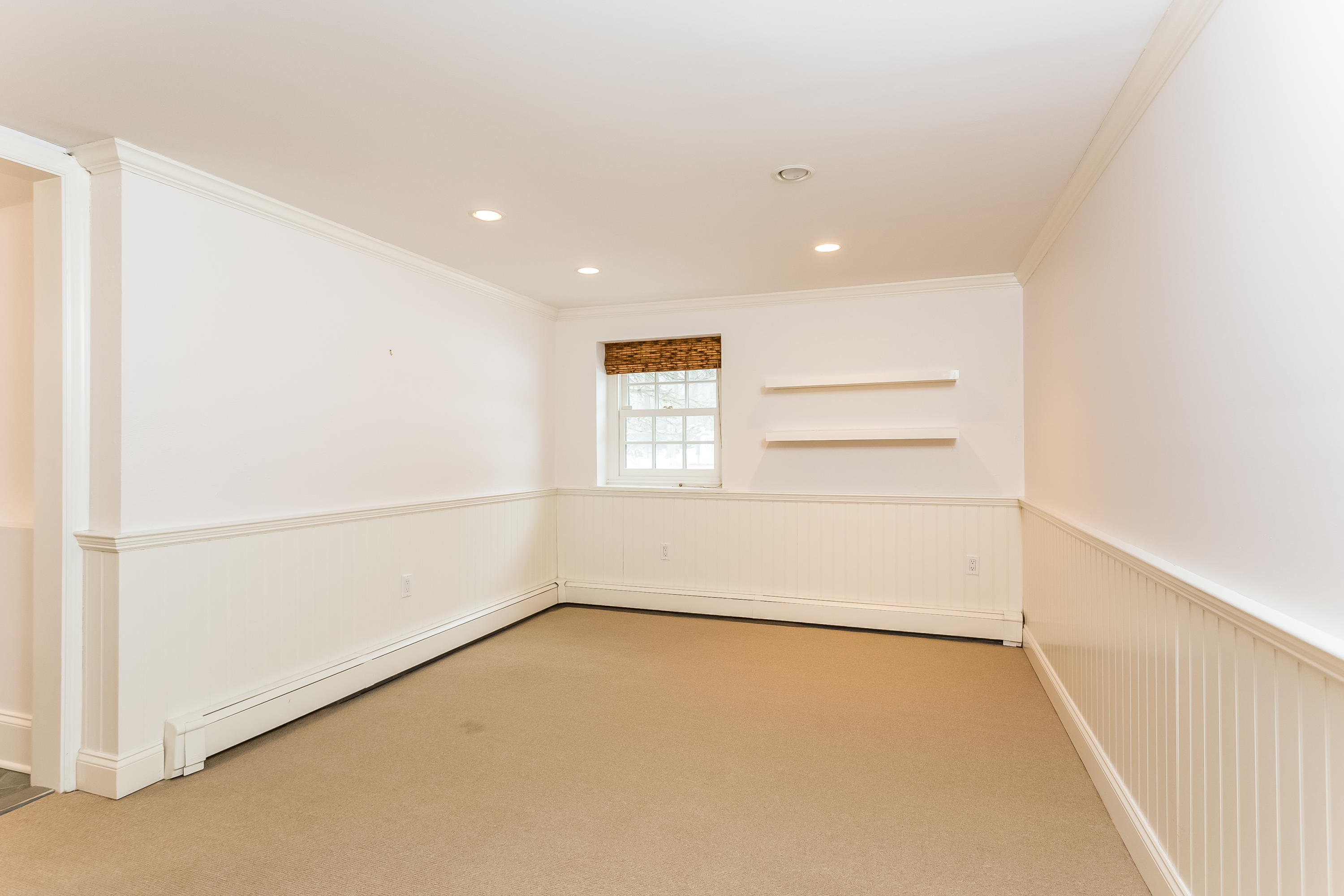 183 Turtle Back Road New Canaan, CT 06840 - Photo 48 of 53 an empty room with a empty space and a window