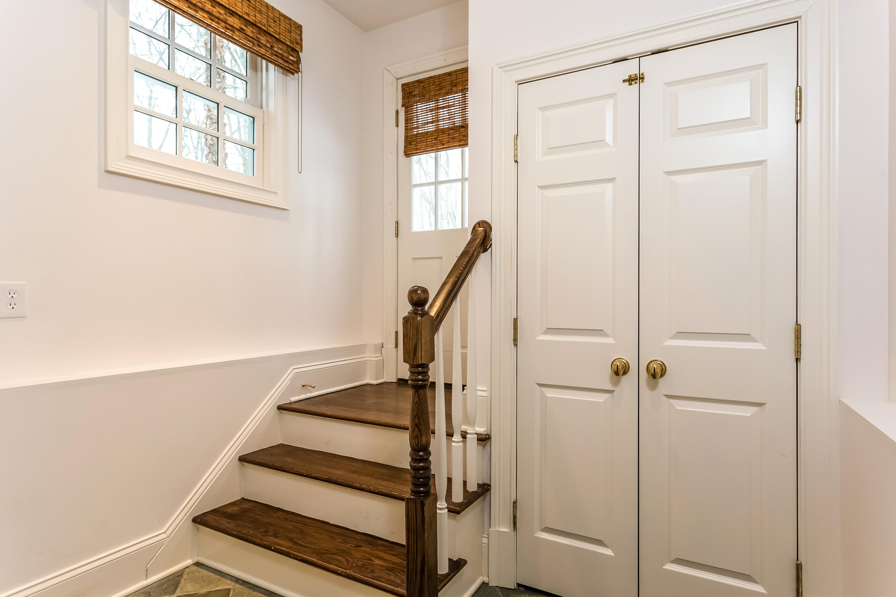 183 Turtle Back Road New Canaan, CT 06840 - Photo 49 of 53 a view of entryway with wooden floor and stairs