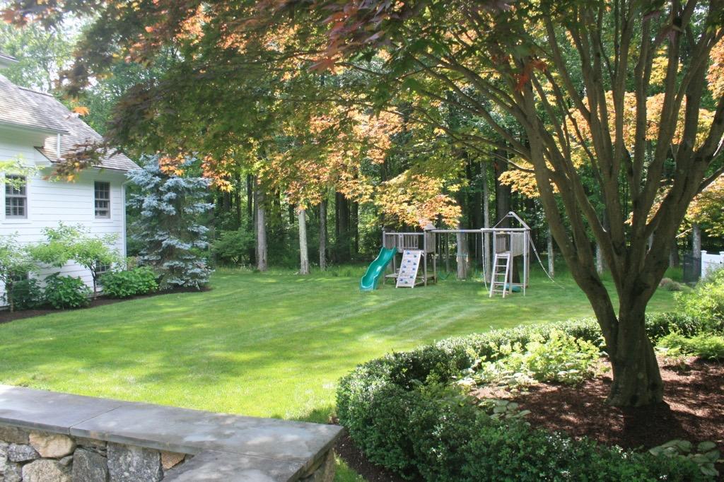 183 Turtle Back Road New Canaan, CT 06840 - Photo 6 of 53 a view of a backyard with a garden
