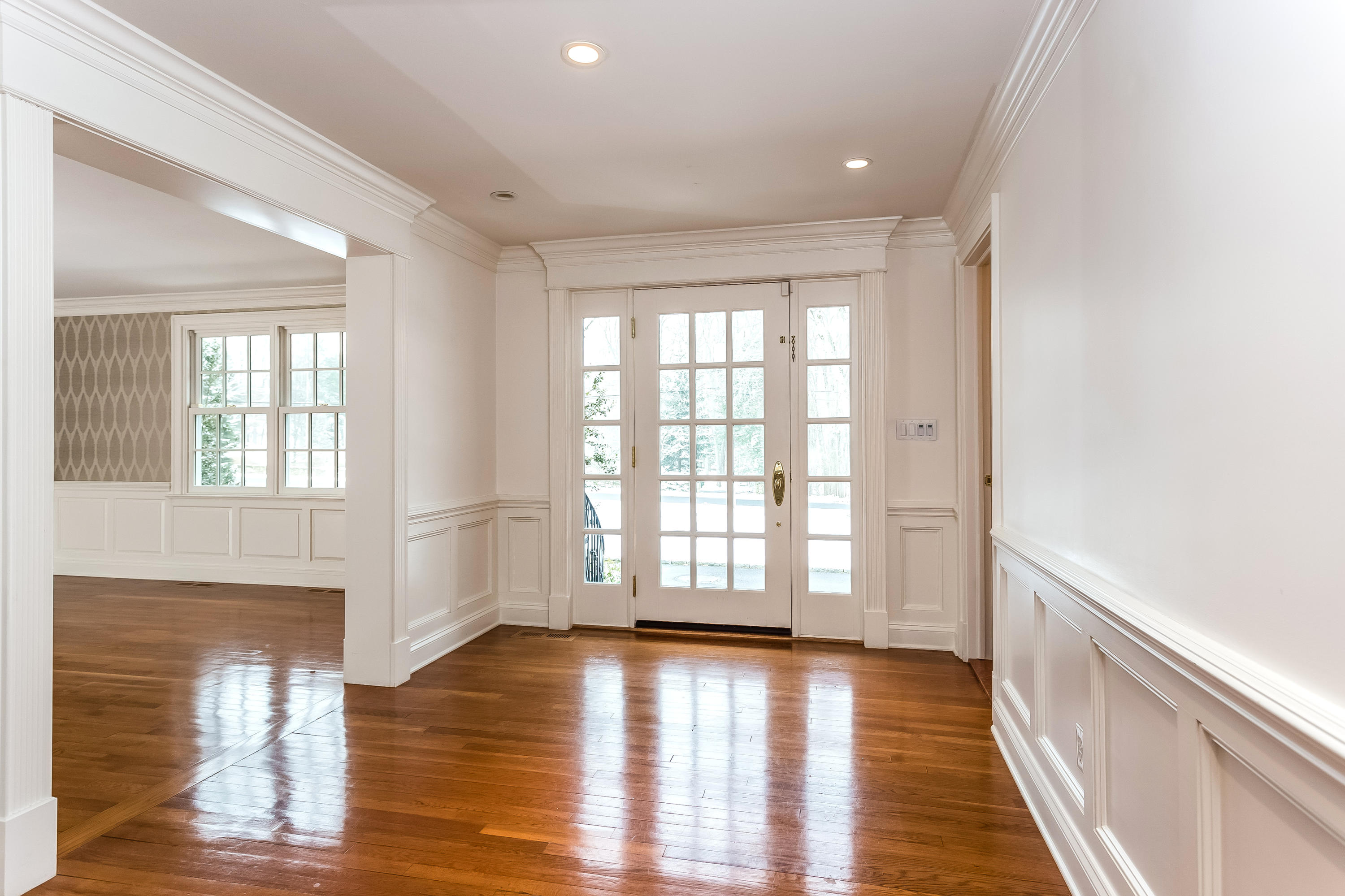 183 Turtle Back Road New Canaan, CT 06840 - Photo 10 of 53 a view of an empty room with wooden floor and a window