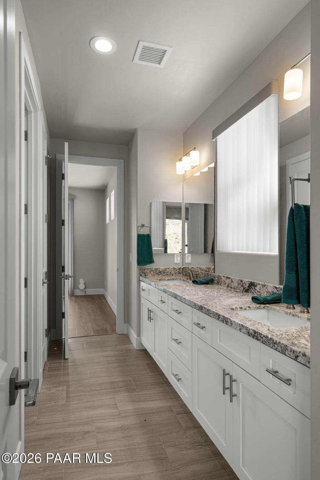 15689 East Orch Vw Road Dewey, AZ 86327 - Photo 15 of 39 a bathroom with a granite countertop sink and a mirror