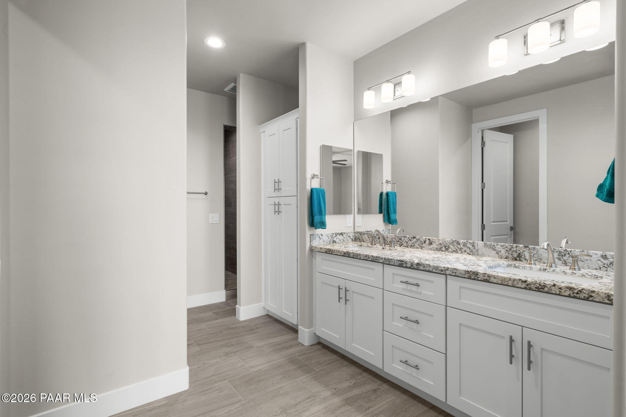 15689 East Orch Vw Road Dewey, AZ 86327 - Photo 25 of 39 a bathroom with a granite countertop sink and a mirror