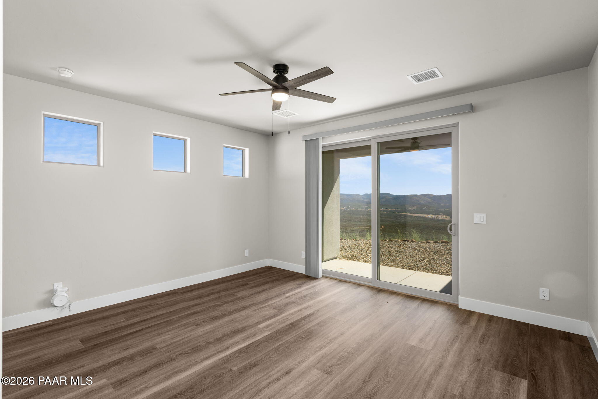 15689 East Orch Vw Road Dewey, AZ 86327 - Photo 27 of 39 a view of an empty room with wooden floor and a window