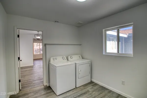 a utility room with dryer and washer