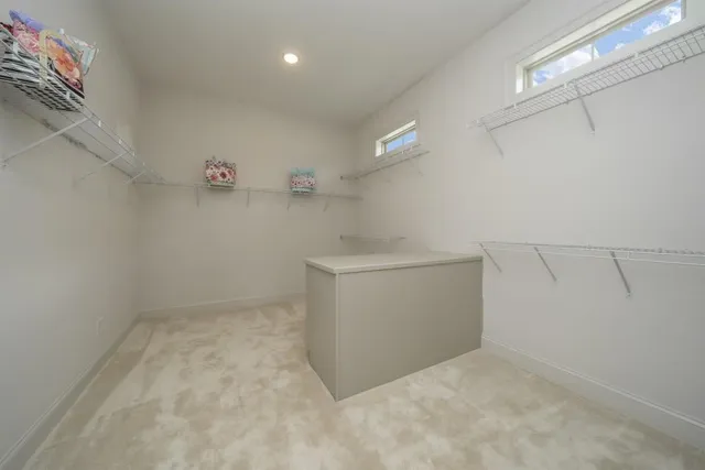 a utility room with cabinets washer and dryer