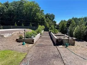 a view of a livingroom with furniture and a fireplace