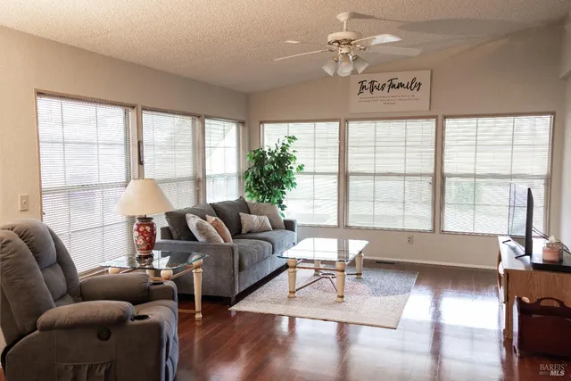 a living room with furniture and a large window