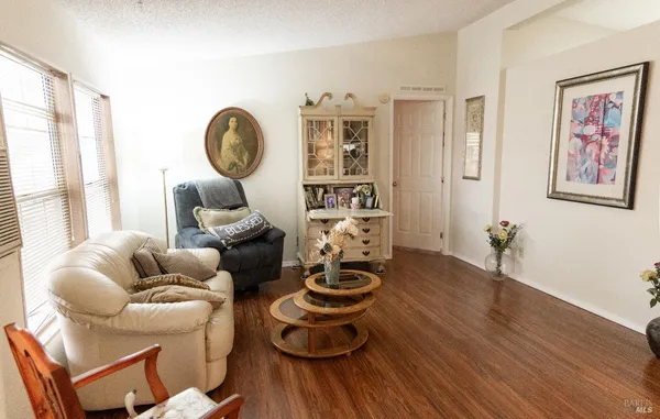a room with furniture and wooden floor