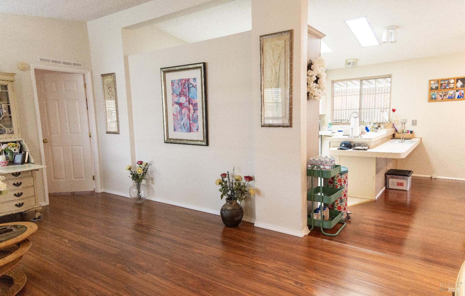171 Colonial Park Drive Santa Rosa, CA 95403 - Photo 12 of 29 a living room with furniture and wooden floor