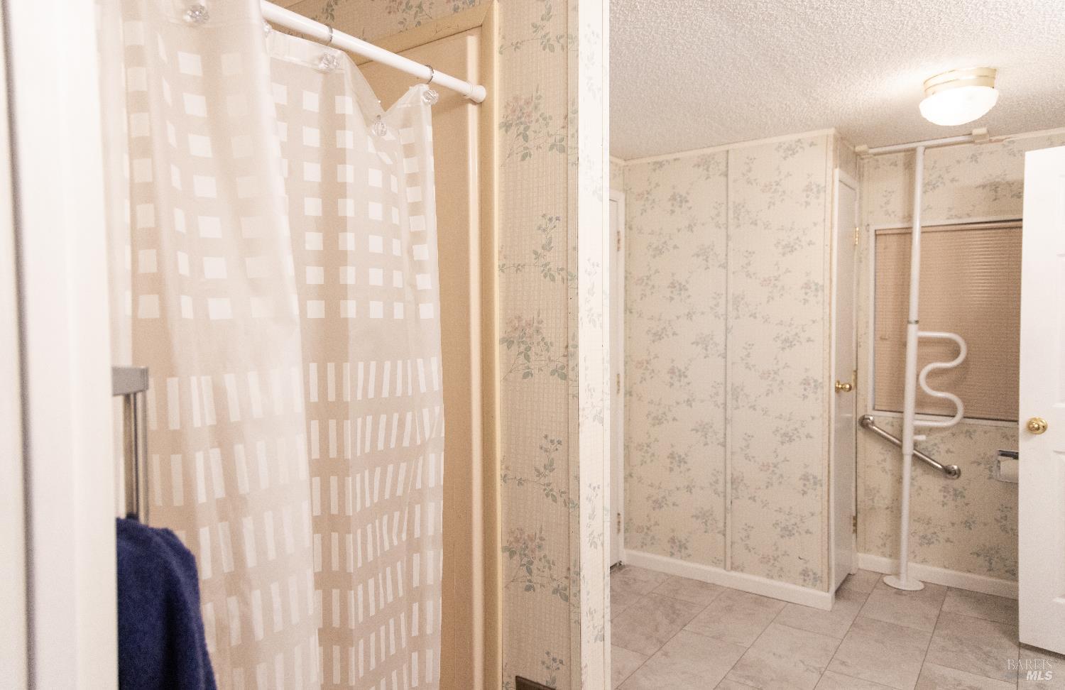 171 Colonial Park Drive Santa Rosa, CA 95403 - Photo 15 of 29 a bathroom with a shower and a glass door
