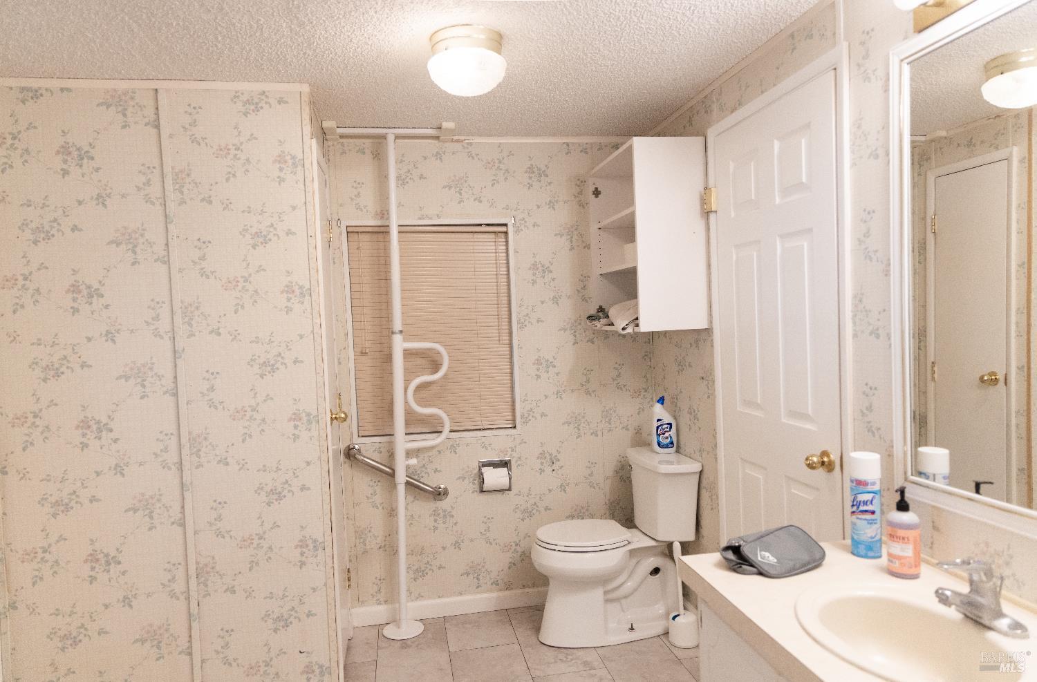 171 Colonial Park Drive Santa Rosa, CA 95403 - Photo 16 of 29 a bathroom with a granite countertop sink toilet and shower