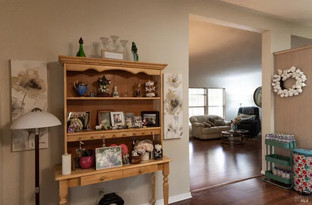 a living room with lots of furniture and a wooden floor
