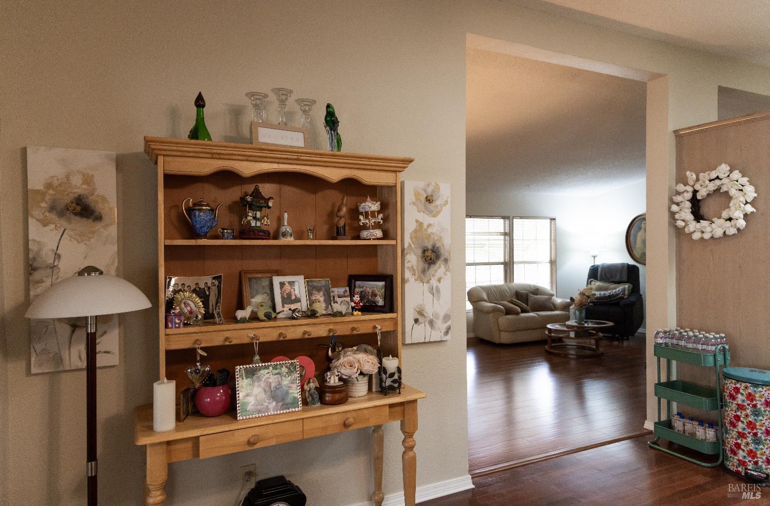 171 Colonial Park Drive Santa Rosa, CA 95403 - Photo 22 of 29 a living room with lots of furniture and a wooden floor