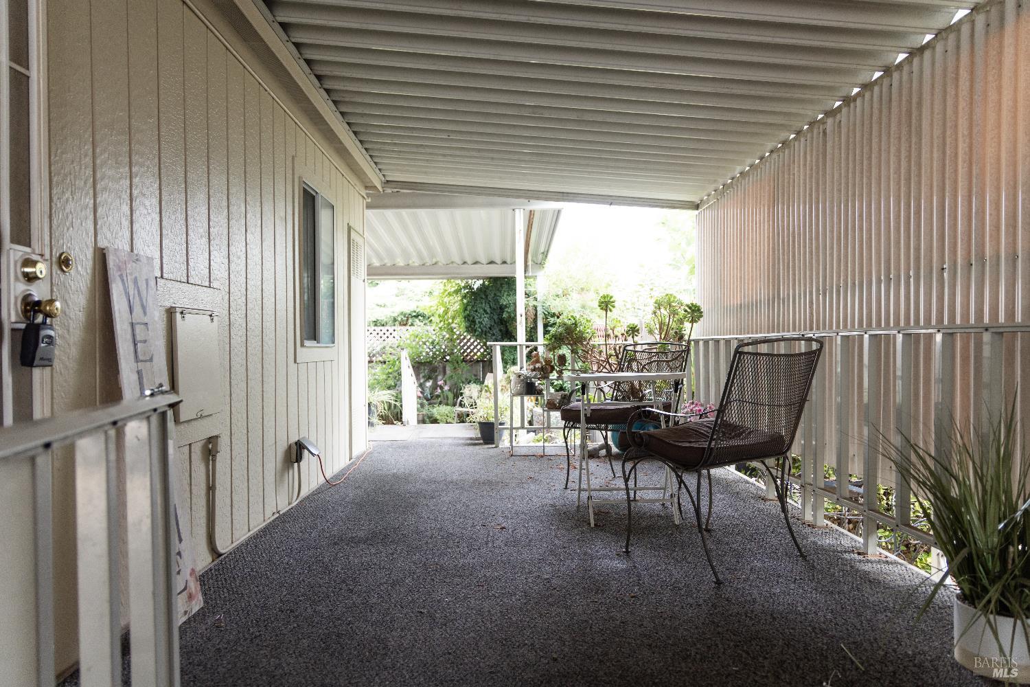 171 Colonial Park Drive Santa Rosa, CA 95403 - Photo 23 of 29 a dining room with furniture and a floor to ceiling window