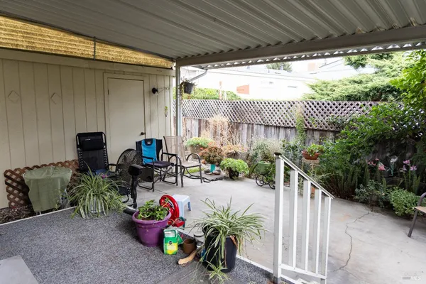 a view of a porch with furniture