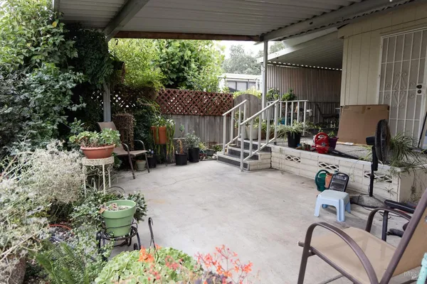 a patio with table and chairs