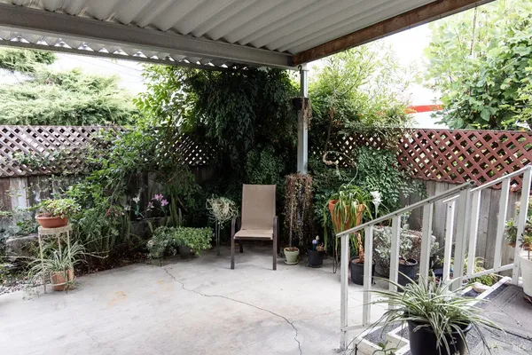 a view of balcony with furniture and garden