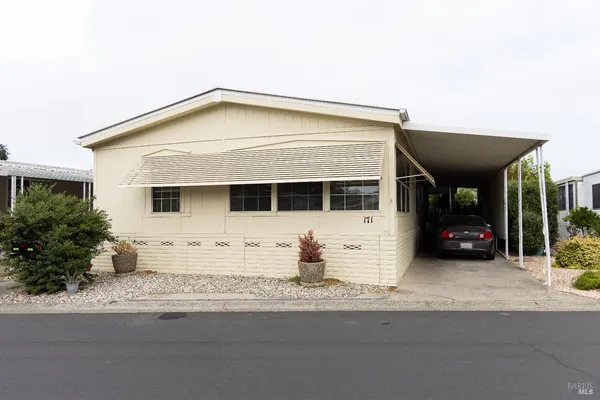 a front view of a house with a garage