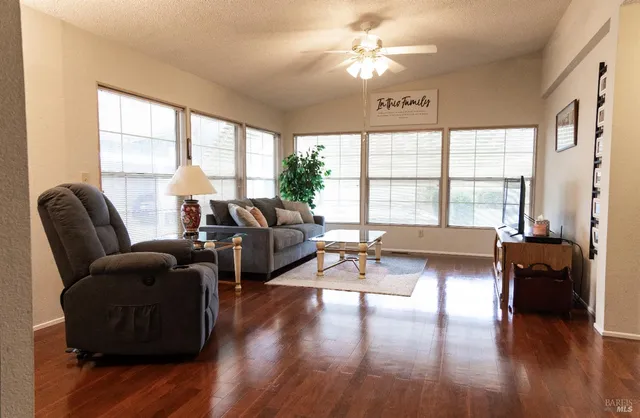 a living room with furniture and a large window