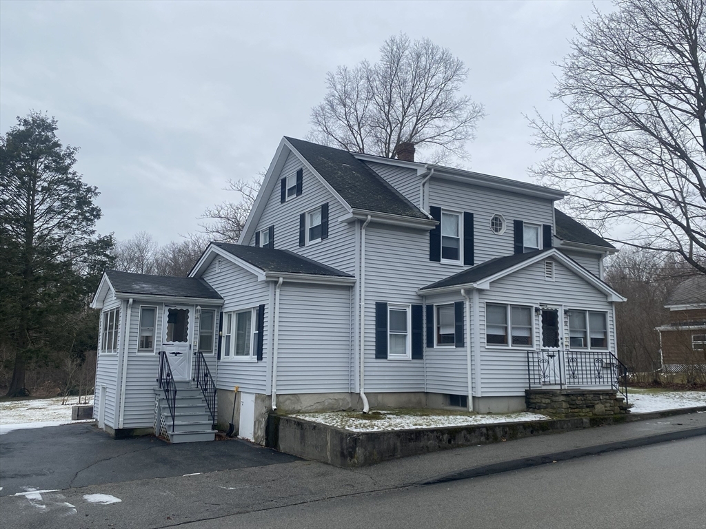 18 Eastern Avenue Webster, MA 01570 - Photo 1 of 36 a front view of a house with a yard