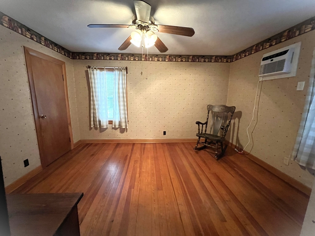 18 Eastern Avenue Webster, MA 01570 - Photo 18 of 36 an empty room with wooden floor and windows