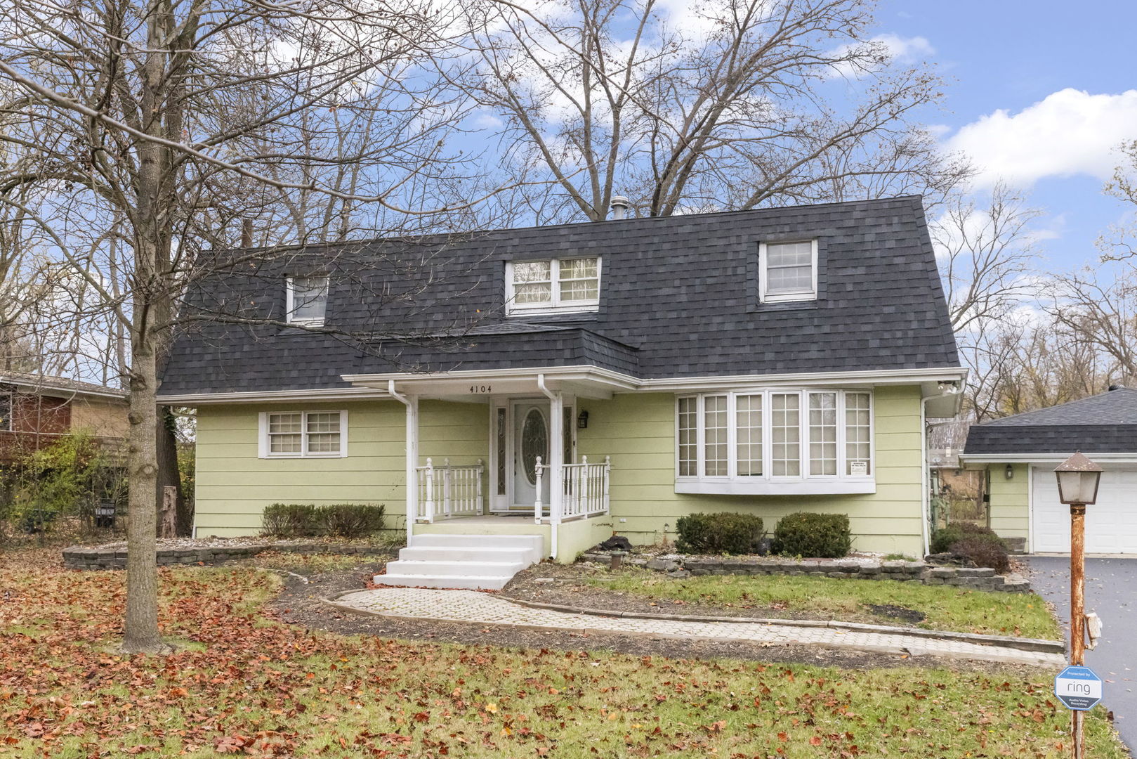 4104 Sunset Road Matteson, IL 60443 - Photo 1 of 34 a front view of a house with a yard and garage