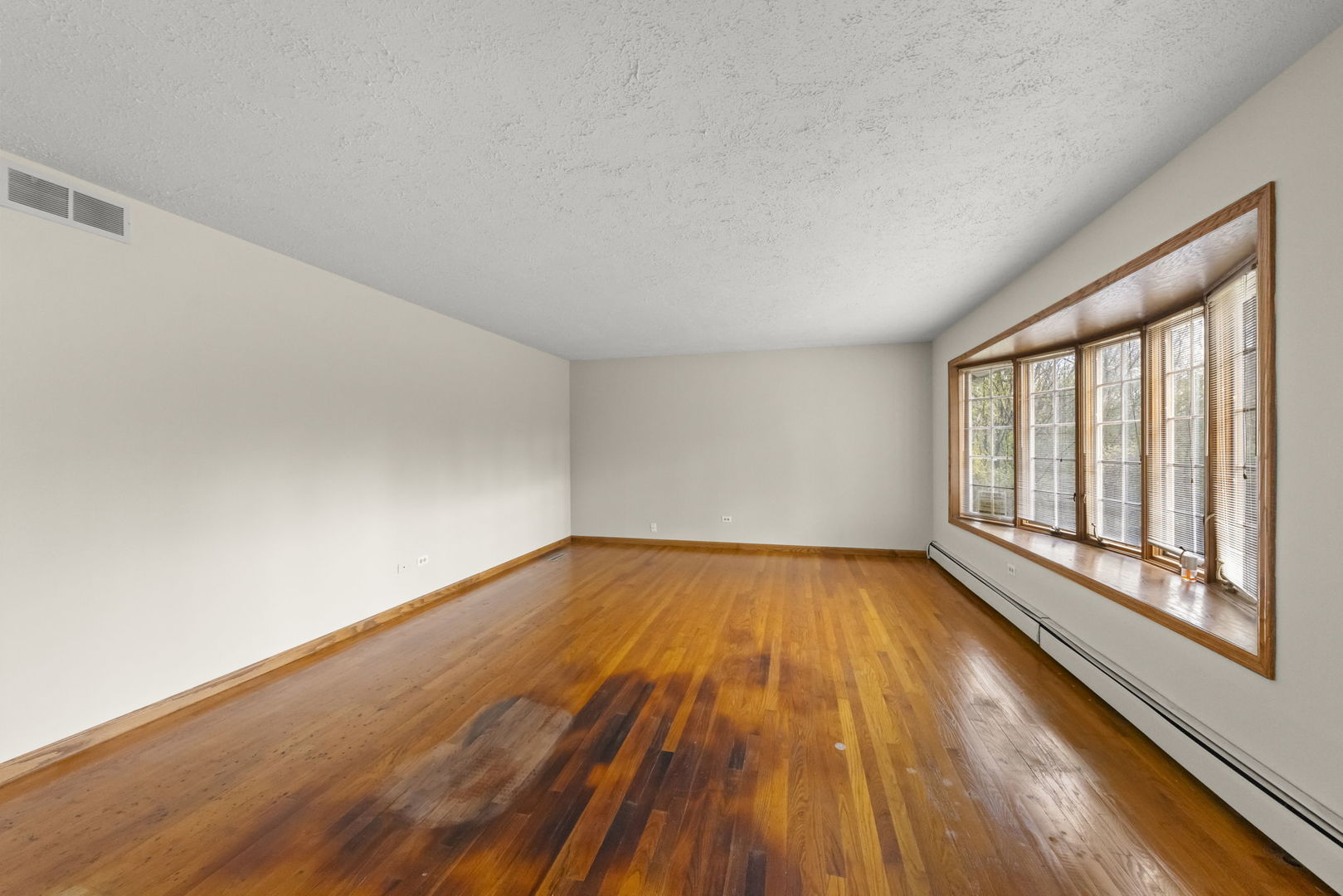 4104 Sunset Road Matteson, IL 60443 - Photo 3 of 34 a view of empty room with wooden floor and fan