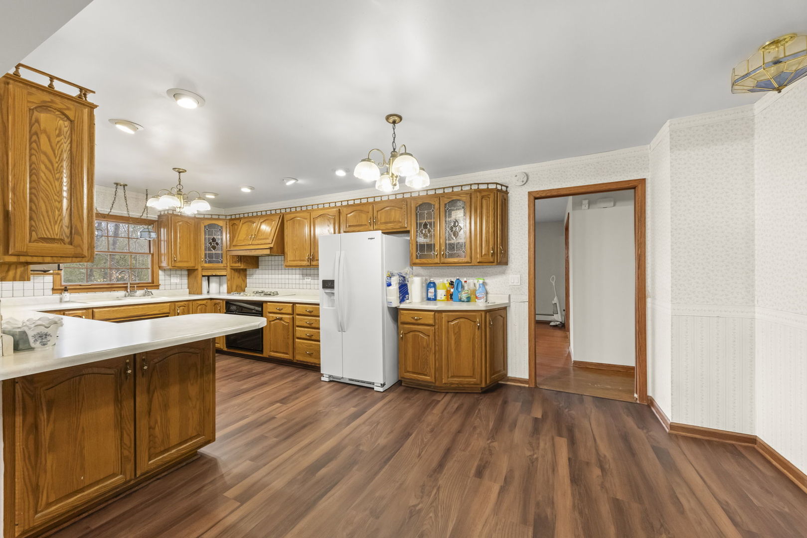 4104 Sunset Road Matteson, IL 60443 - Photo 7 of 34 a kitchen with stainless steel appliances granite countertop a sink stove and wooden floor