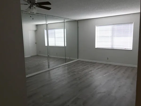 a view of an empty room with a window
