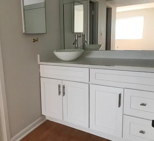 a bathroom with a sink and a mirror