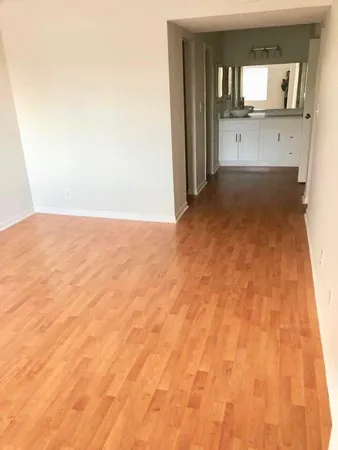 a view of a bathroom with sink and mirror