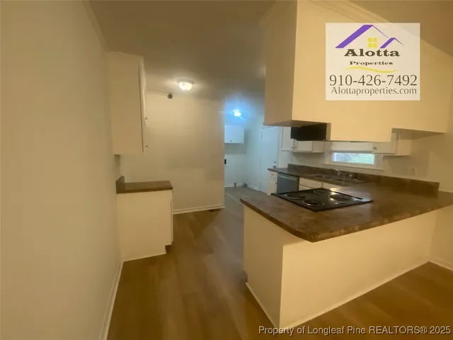 a kitchen with a stove and a refrigerator