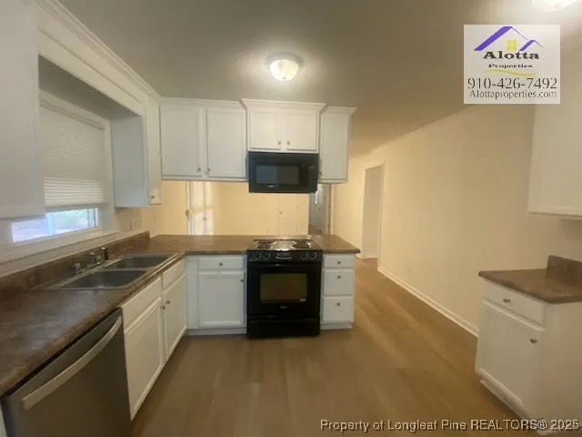 a kitchen with a stove and a sink
