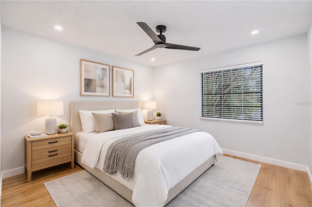 11033 Springridge Drive Tampa, FL 33624 - Photo 11 of 33 a bedroom with a large bed and a window