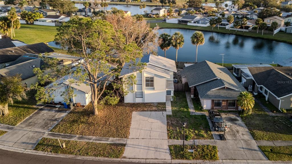 11033 Springridge Drive Tampa, FL 33624 - Photo 13 of 33 an aerial view of a house with swimming pool and outdoor space