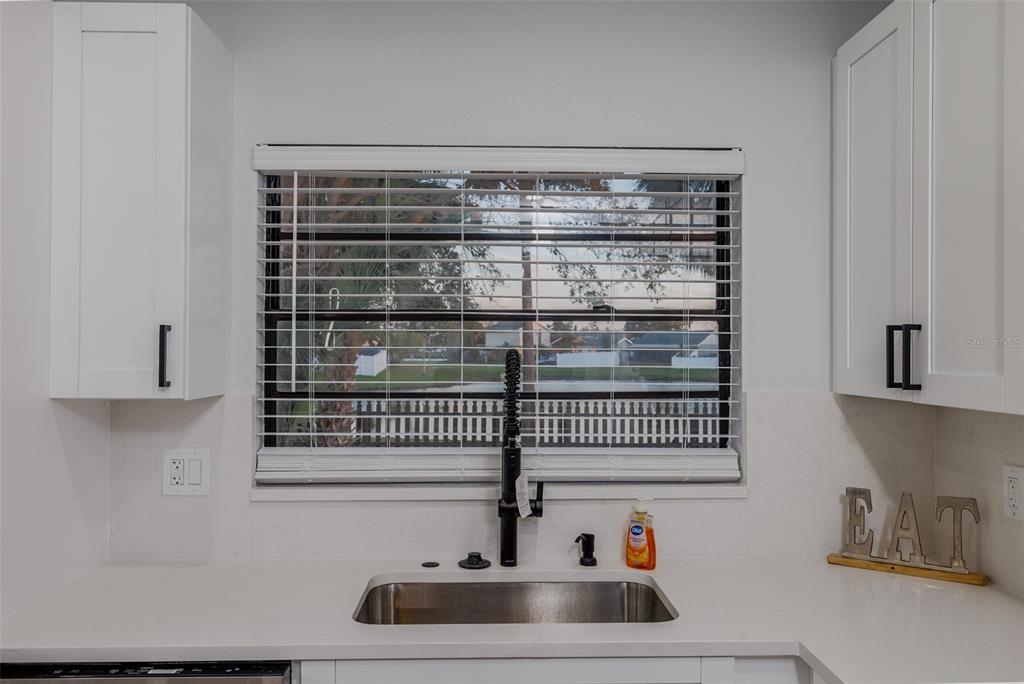 11033 Springridge Drive Tampa, FL 33624 - Photo 15 of 33 a bathroom with a sink and mirror